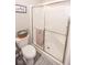 Clean bathroom featuring a glass-enclosed shower and a toilet, with a neutral color scheme for a fresh feel at 9752 Brook Wood Dr, McCordsville, IN 46055