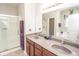 Elegant bathroom with dual sinks, a walk-in shower, and a soaking tub at 9752 Brook Wood Dr, McCordsville, IN 46055