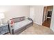 Cozy bedroom featuring a stylish daybed, comfortable carpeting, and a neutral color palette for relaxation at 9752 Brook Wood Dr, McCordsville, IN 46055