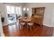 Bright dining area with sliding glass doors and a traditional wooden hutch for storage and style at 9752 Brook Wood Dr, McCordsville, IN 46055