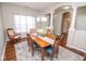Elegant dining room filled with natural light features a classic table setting and stylish decor at 9752 Brook Wood Dr, McCordsville, IN 46055