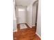 Bright foyer with gleaming hardwood floors, white trim, and neutral paint palette at 9752 Brook Wood Dr, McCordsville, IN 46055