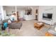 Spacious living room with an open layout, seamlessly connecting to the kitchen and dining area at 9752 Brook Wood Dr, McCordsville, IN 46055
