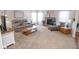 Spacious living room features a comfortable seating arrangement, fireplace, and natural light from the many windows at 9752 Brook Wood Dr, McCordsville, IN 46055