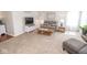 Inviting living room with comfortable seating, neutral carpet, and a stylish entertainment center at 9752 Brook Wood Dr, McCordsville, IN 46055