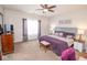 Cozy main bedroom featuring a king bed, a dresser, and a tv at 9752 Brook Wood Dr, McCordsville, IN 46055