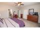 Bright main bedroom featuring a king bed, wooden furniture, and a relaxing ambiance at 9752 Brook Wood Dr, McCordsville, IN 46055