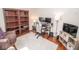 Well-furnished home office with a cozy armchair, and computer station, perfect for productivity and relaxation at 9752 Brook Wood Dr, McCordsville, IN 46055