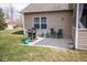 Relaxing outdoor patio with comfortable seating, grill, and an open backyard space at 9752 Brook Wood Dr, McCordsville, IN 46055