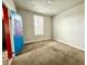 An interior shot of an empty bedroom featuring a window and light colored walls at 980 Edgemont Ave, Indianapolis, IN 46208