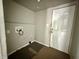A mud room with a door and washing machine hookups, primed for modern living at 980 Edgemont Ave, Indianapolis, IN 46208