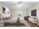 Cozy bedroom featuring hardwood floors, a large window, and a comfortably appointed queen-sized bed at 9856 Commonwealth Dr, Fishers, IN 46038