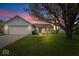 Charming single-story home with a well-maintained lawn, attached two-car garage, and inviting curb appeal at 9856 Commonwealth Dr, Fishers, IN 46038