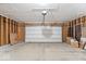 Spacious garage with large door and plenty of storage for vehicles and other items at 9856 Commonwealth Dr, Fishers, IN 46038