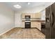 Bright kitchen featuring stainless steel appliances and neutral colored cabinetry at 9856 Commonwealth Dr, Fishers, IN 46038