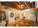 Basement laundry room with washer and dryer, utility sink, and storage at 1019 N Lesley Ave, Indianapolis, IN 46219