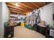 Cozy basement storage room featuring shelving, neatly organized boxes, and a vintage clock at 1019 N Lesley Ave, Indianapolis, IN 46219