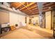 Unfinished basement with exposed wooden beams and modern water heater is ready to be transformed at 1019 N Lesley Ave, Indianapolis, IN 46219