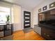 Light-filled entryway featuring modern door with sleek design elements and a view to the outside at 1019 N Lesley Ave, Indianapolis, IN 46219