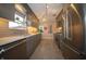 Well-lit kitchen with stainless steel appliances, gray cabinets, quartz countertops, and gray subway tile backsplash at 1019 N Lesley Ave, Indianapolis, IN 46219