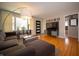 Bright living room with hardwood floors, stylish lighting, and comfortable seating arrangement creating a warm ambiance at 1019 N Lesley Ave, Indianapolis, IN 46219