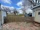 Fenced backyard with stone path and adjacent building at 11522 N 450 W, Alexandria, IN 46001