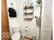 Bathroom featuring unique shelves, neutral paint, tile floor, and a toilet at 11522 N 450 W, Alexandria, IN 46001