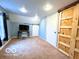 Bedroom features carpet, natural light, and unique accent wall at 11522 N 450 W, Alexandria, IN 46001