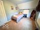 Neutral bedroom with carpet, natural light, single bed, and nautical decor at 11522 N 450 W, Alexandria, IN 46001