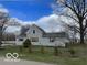 Charming two-story home with mature trees and landscaping on a spacious lot at 11522 N 450 W, Alexandria, IN 46001