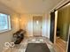 Foyer featuring tile flooring, coat rack, and a sliding barn door at 11522 N 450 W, Alexandria, IN 46001