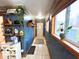 Bright hallway with built-in shelves, natural light, neutral paint, and tile floors at 11522 N 450 W, Alexandria, IN 46001