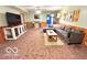 Spacious living room with a large sectional sofa and neutral-toned carpet at 11522 N 450 W, Alexandria, IN 46001