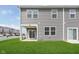 Backyard view showcases a well-maintained lawn, and a covered patio for outdoor enjoyment at 1239 Newton St, Avon, IN 46123