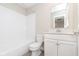 Stylish bathroom featuring tiled walls, a vanity with sink, and modern fixtures at 1239 Newton St, Avon, IN 46123