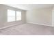 Bright bedroom with neutral tones, large windows, and plush carpeting, offering a serene retreat at 1239 Newton St, Avon, IN 46123