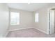 Light-filled bedroom with two windows and a door adding to the welcoming ambiance at 1239 Newton St, Avon, IN 46123