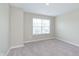 Cozy bedroom with plush carpet and natural light streaming through the window at 1239 Newton St, Avon, IN 46123