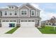 Charming two-story townhome with gray siding, a two-car garage, and a well-manicured lawn at 1239 Newton St, Avon, IN 46123