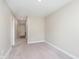 Hallway with neutral walls and carpet flooring, connecting different areas of the house at 1239 Newton St, Avon, IN 46123