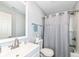 Bright bathroom featuring a vanity with stainless fixtures, shower with curtain, and a tile backsplash at 14060 Princewood Dr, Fishers, IN 46037
