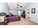 Spacious bedroom with vaulted ceiling, ceiling fan, and a doorway to an ensuite bathroom at 14060 Princewood Dr, Fishers, IN 46037