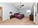 Spacious bedroom with vaulted ceiling, ceiling fan, and a large window overlooking the backyard at 14060 Princewood Dr, Fishers, IN 46037