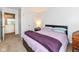 Bedroom featuring neutral carpet, a queen bed, and a door to another room at 14060 Princewood Dr, Fishers, IN 46037