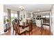 Cozy dining area adjacent to the kitchen with wooden table and chairs, and sliding glass doors at 14060 Princewood Dr, Fishers, IN 46037