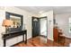 Welcoming foyer with hardwood floors and an ornate mirror, leading into the home at 14060 Princewood Dr, Fishers, IN 46037