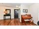 Warm and inviting foyer featuring hardwood floors, a console table, and a piano at 14060 Princewood Dr, Fishers, IN 46037