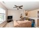Inviting living room with neutral carpeting, cozy armchairs, and a ceiling fan for added comfort at 14060 Princewood Dr, Fishers, IN 46037