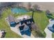 Aerial view of beautiful home featuring a large pond, outdoor patio, and a detached garage at 1471 S Frog Pond Ct, Greenfield, IN 46140