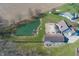 Overhead view of property with large pond, private backyard with pool and in-ground trampoline at 1471 S Frog Pond Ct, Greenfield, IN 46140